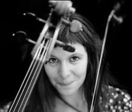 Helen Gillet posing with her cello