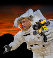 Kevin Harris' face photoshopped onto a photo of an astronaut holding a camera